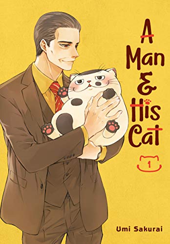 Man in suit holding a large, fluffy black and white cat.