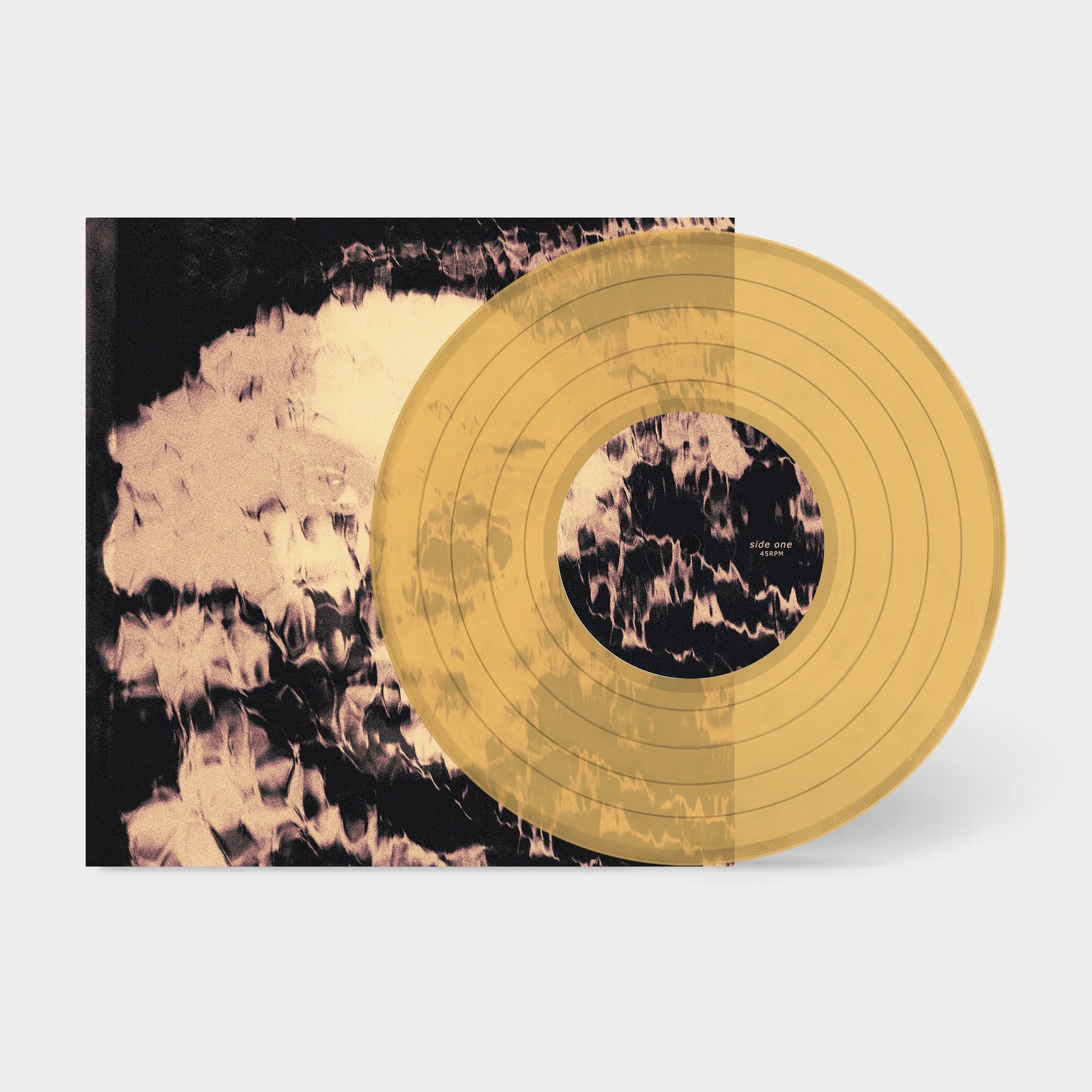 Yellow vinyl record with blurred, abstract cover art beside it.