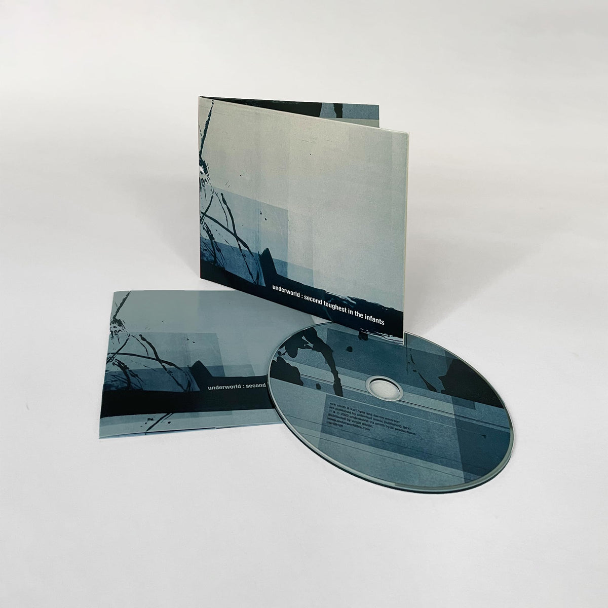 CD case and disc for Underworld’s “Second Toughest In The Infants” album.