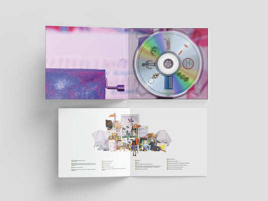 Underworld’s “Strawberry Hotel” CD case with colorful, surrealist cover art.