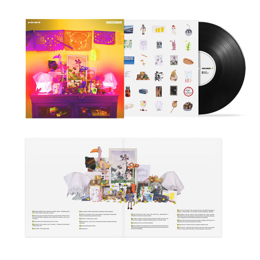 Underworld Strawberry Hotel vinyl record with colorful cover art, inner sleeve, and black disc.
