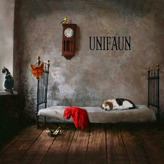 Surreal room scene with a sleeping dog, a fox mask, and the word Unifaun.