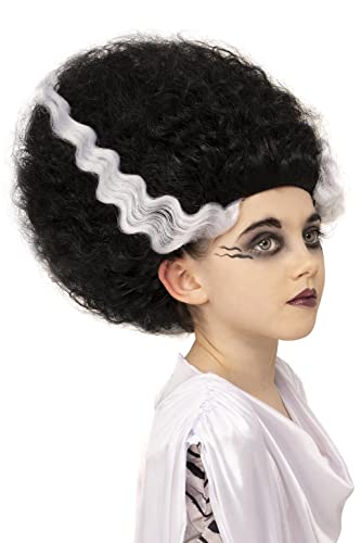 Girl wearing a black, curly wig with a white streak, makeup applied.