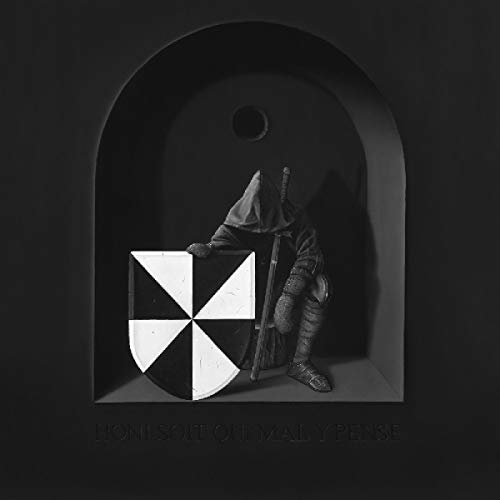 "Black-and-white album cover with a hooded figure holding a pinwheel-patterned box."