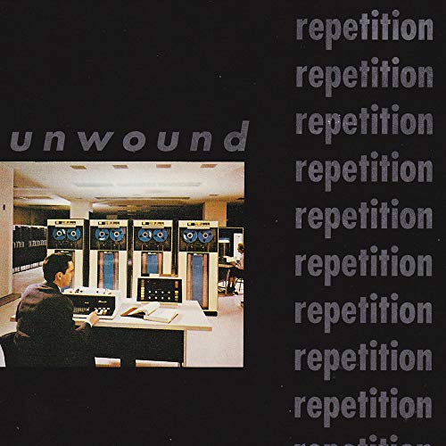 Vinyl cover featuring a man at a computer with the word repetition repeated vertically.