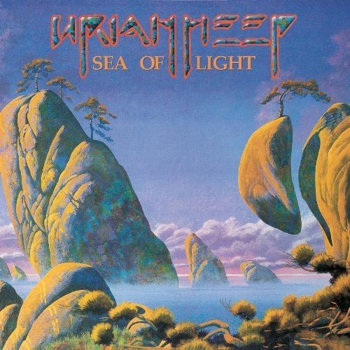 "Uriah Uriah's 'Sea of Light' CD cover, featuring fantastical rocky landscape with trees and water."