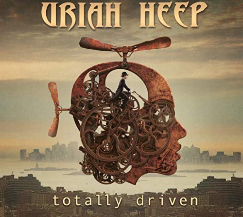 Uriah Heep Totally Driven CD cover featuring a mechanical head over a city skyline.