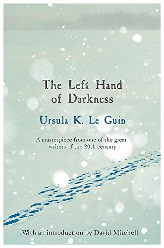 "Book cover of 'The Left Hand of Darkness' with snowy, pale green background and blue streaks."