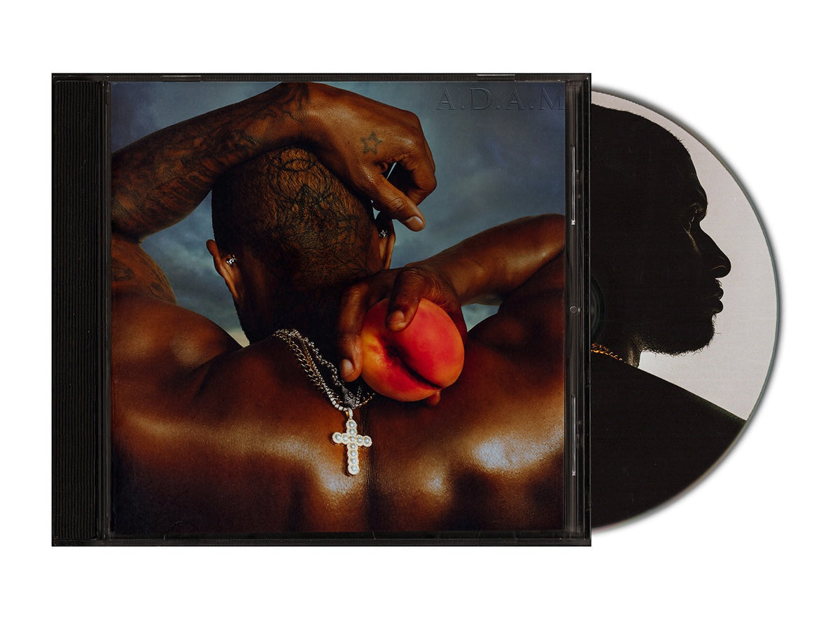 Usher’s “A.d.a.m” CD case with a shirtless figure and a peach.