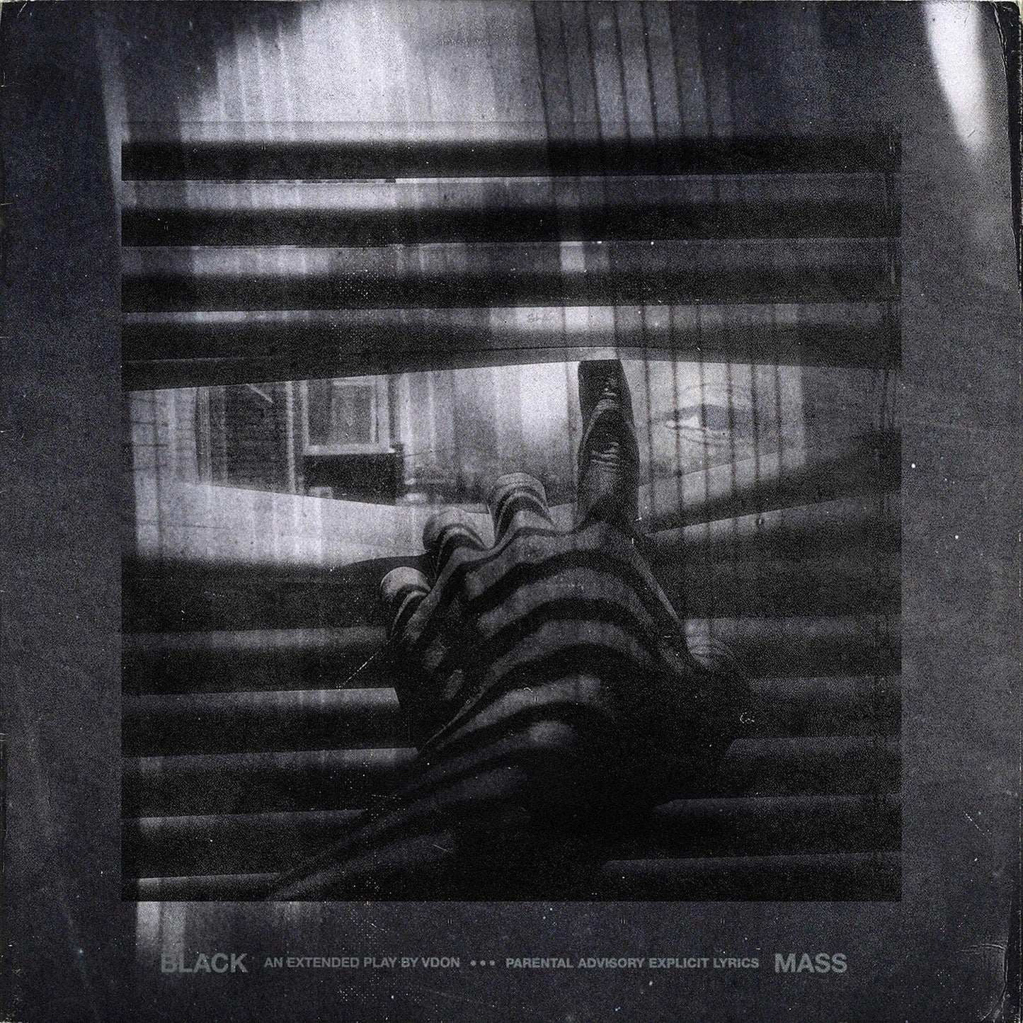 Black and white vinyl record cover with a hand reaching through blinds.