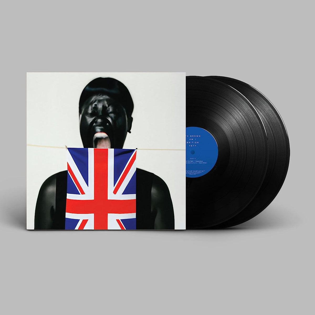 Vinyl record with cover featuring a person holding a Union Jack flag.