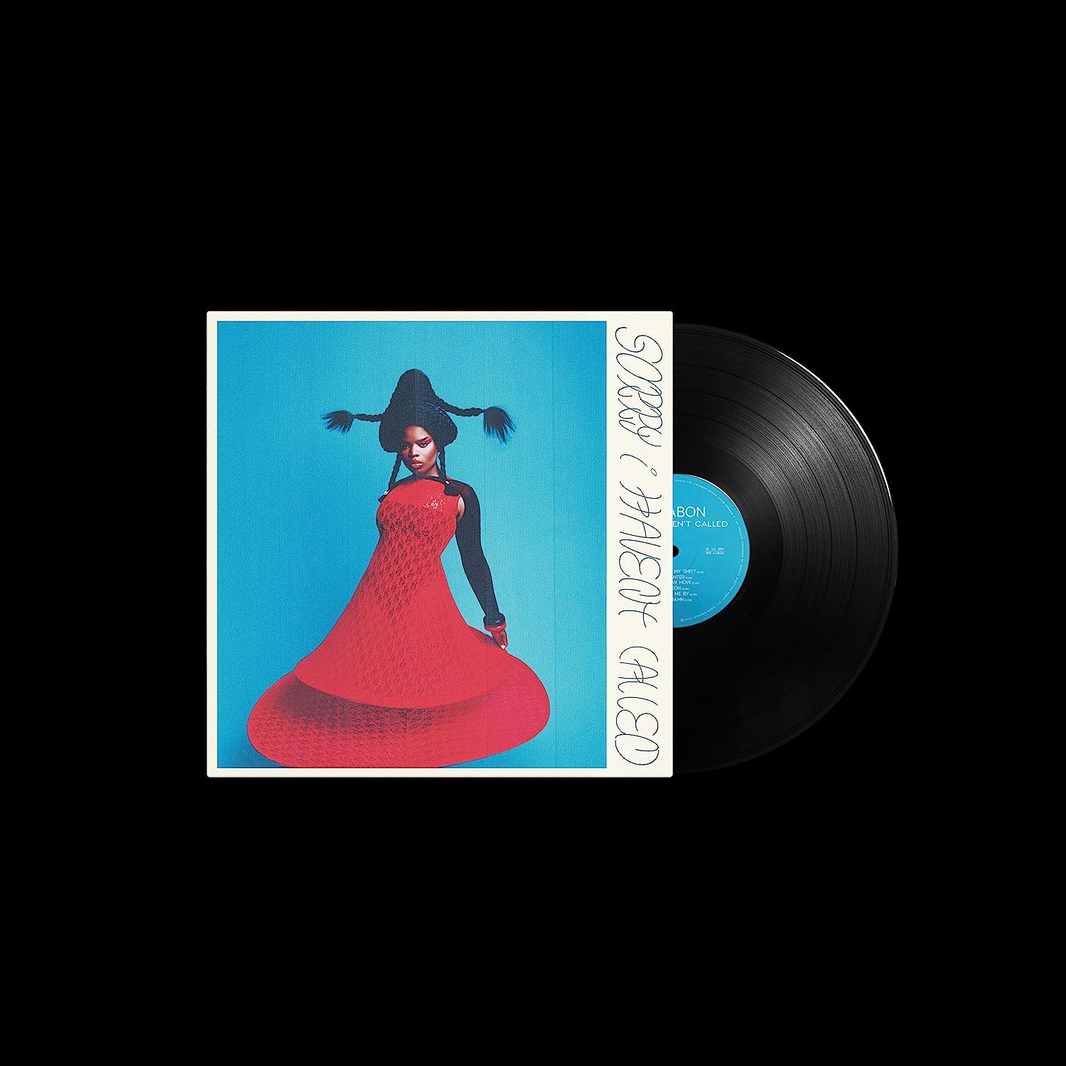"Vinyl record sleeve with a woman in a red dress on a blue background."