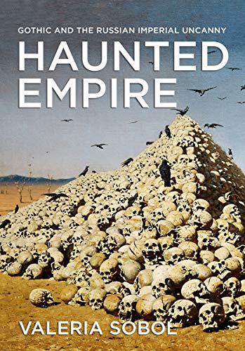 Book cover: "Haunted Empire" with a skull-covered hill and dark birds.