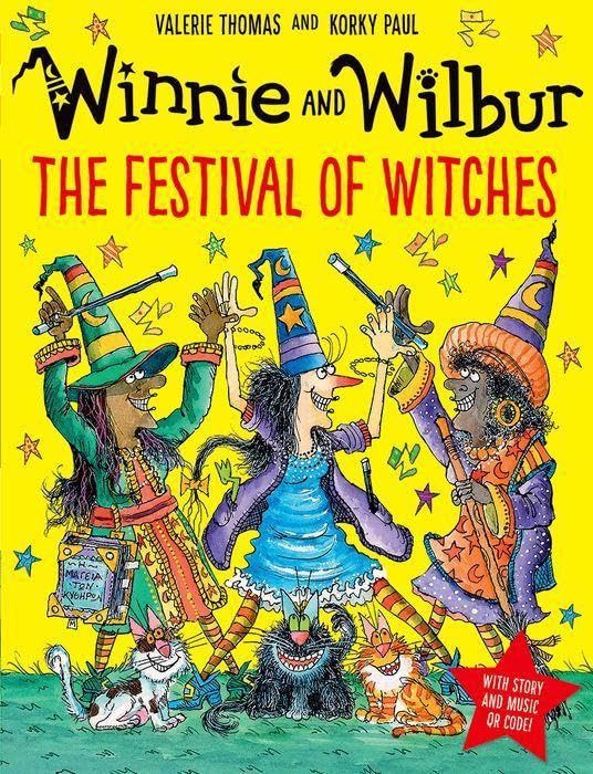 Colorful illustration of Winnie and Wilbur with other witches celebrating.
