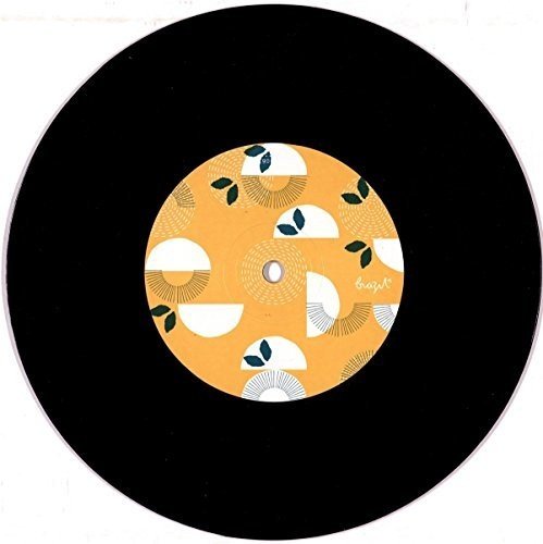 A black seven-inch vinyl record with a yellow label featuring abstract white semi-circle patterns.