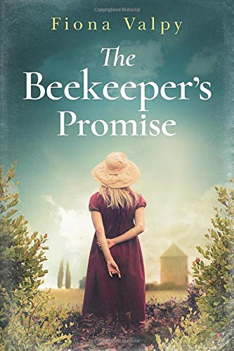 Book cover: woman in a hat looking towards a hazy landscape.