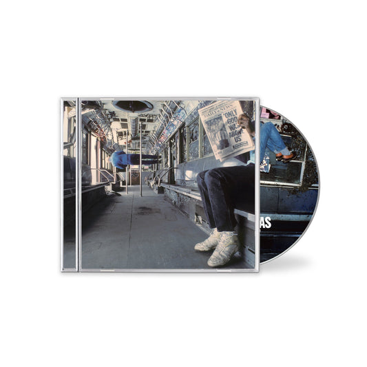 Vampire Weekend album cover featuring a person reading on a subway.