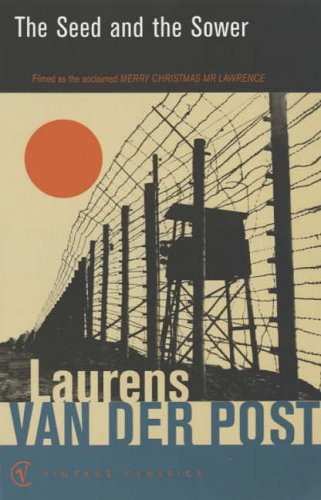 Book cover showing a barbed wire fence and guard tower against a red sun.