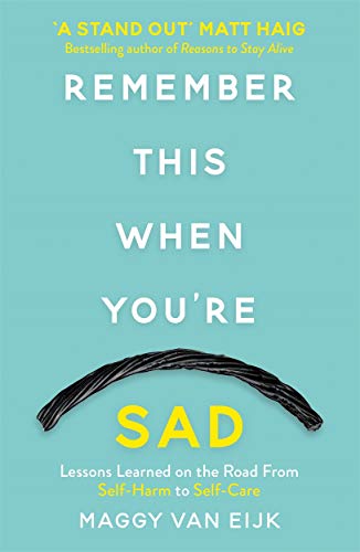 Book cover with teal background, white text, and black licorice piece.