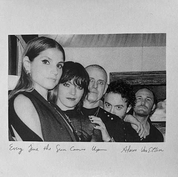 Black and white album cover featuring a group portrait and handwritten text.