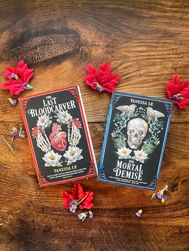 Two fantasy novels with skull and heart imagery, surrounded by red flowers.