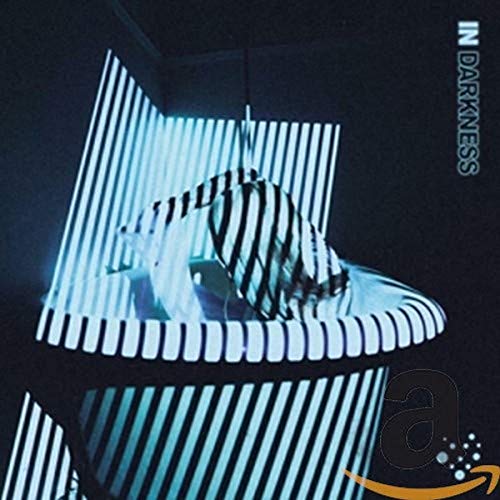 CD cover for Varials' "In Darkness" featuring abstract blue and white lines.