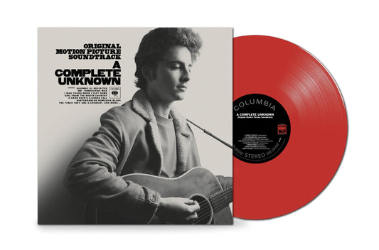 Red vinyl record with a black and white portrait of Bob Dylan.