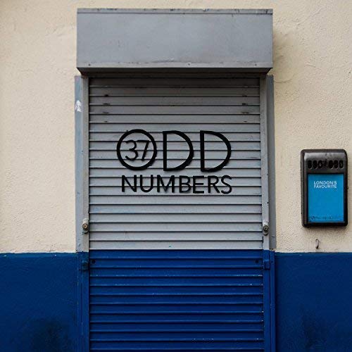 Album cover featuring bold black text on a gray shutter background.