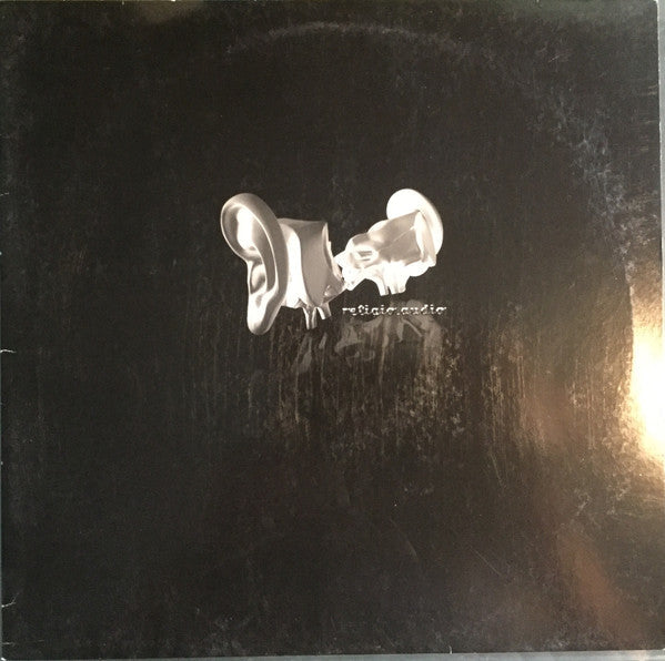 Black vinyl record cover with silver ear-shaped design and text.