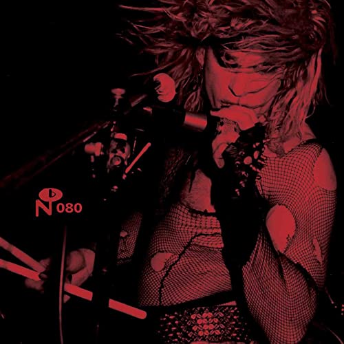 Red-toned image of a rock singer performing with a microphone.