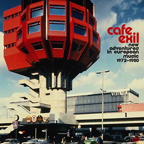 Album cover: red tower over a busy airport terminal, text overlay.