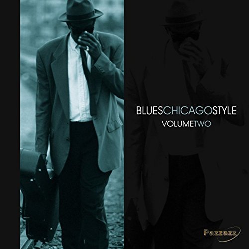 CD cover: Man in a suit with hat, dark and moody tone.