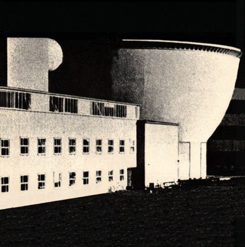 Black and white image of a modernist building with rounded forms.