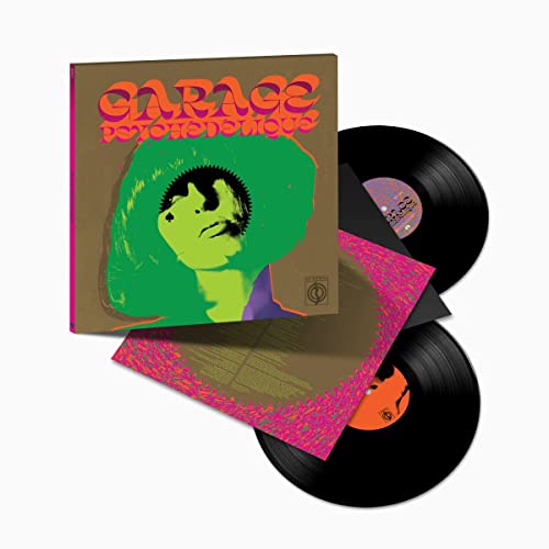 Vinyl record set with a psychedelic cover featuring a green-haired figure and text.