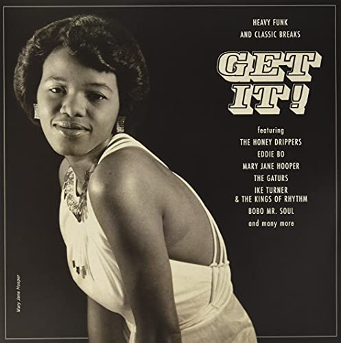 Vinyl record cover featuring a portrait of a woman and text “GET IT!”.
