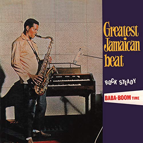 A man plays saxophone in a studio next to an organ, with album text overlay.