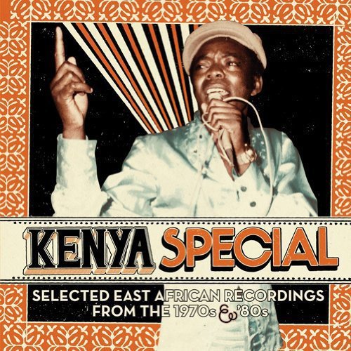 Album cover with man singing into a microphone, red and white border.