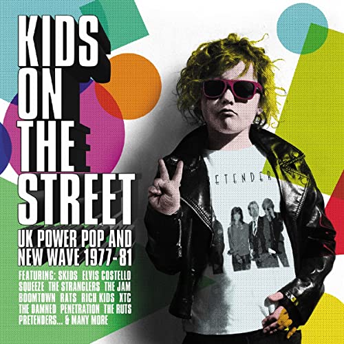 CD cover: boy with sunglasses making a peace sign, colorful background.