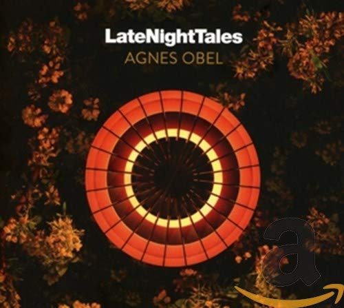 CD cover with a red target design and floral background.