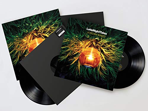 Vinyl record set with green and gold lantern artwork, black sleeves.