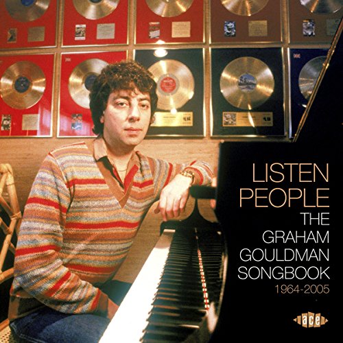 Graham Gouldman with gold records and album cover text "Listen People.