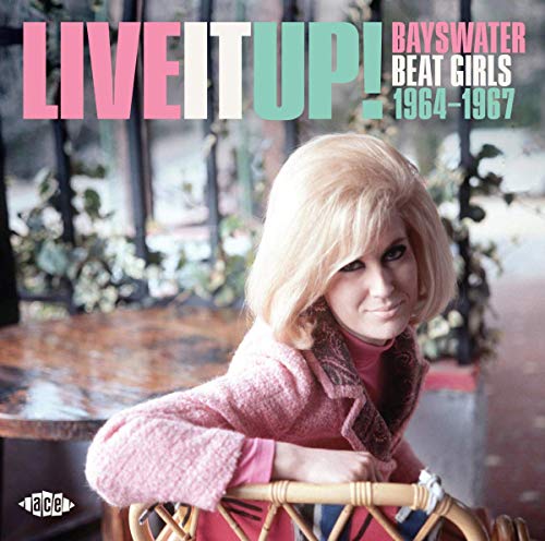 CD cover: woman with blonde hair, pink jacket, outdoor cafe scene.