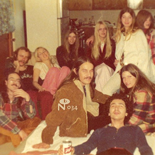 A group of young people gathered in a living room, vintage 1970s photograph style.