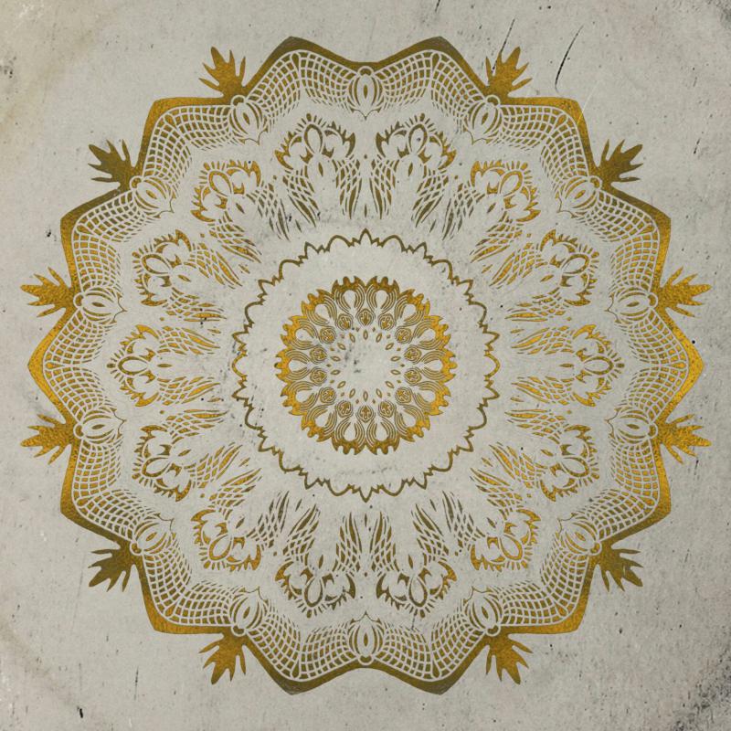 Gold mandala design on a textured, light gray background.