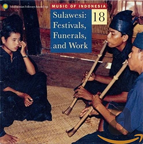 CD cover featuring two Indonesian men playing bamboo flutes, woman observing.
