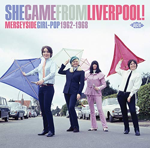 CD cover: four people with kites on a residential street.