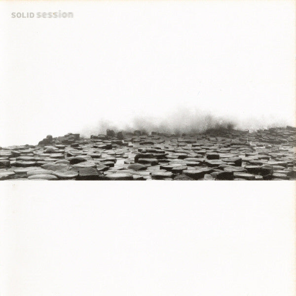 CD cover: black and white image of hexagonal basalt columns.
