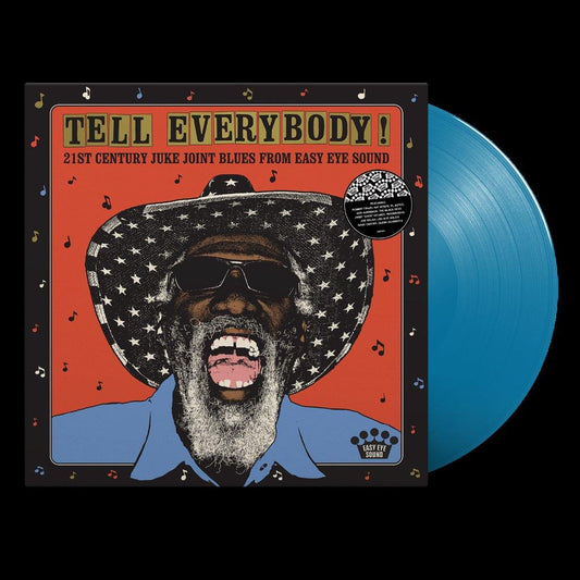 Vinyl record sleeve with man wearing star-patterned hat and blue shirt on orange background.
