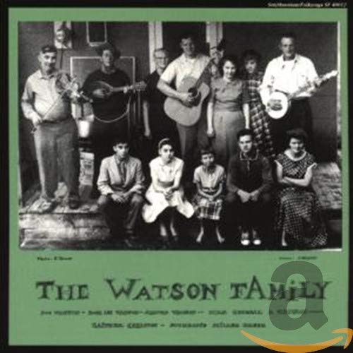 Black and white photo of the Watson family with musical instruments.