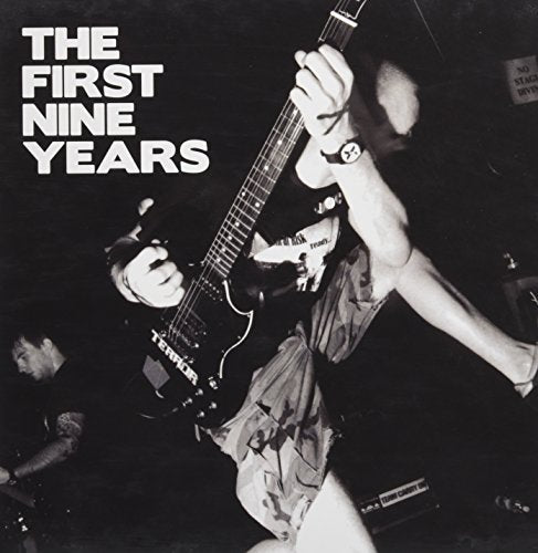 Black and white vinyl record cover featuring a guitarist in performance.